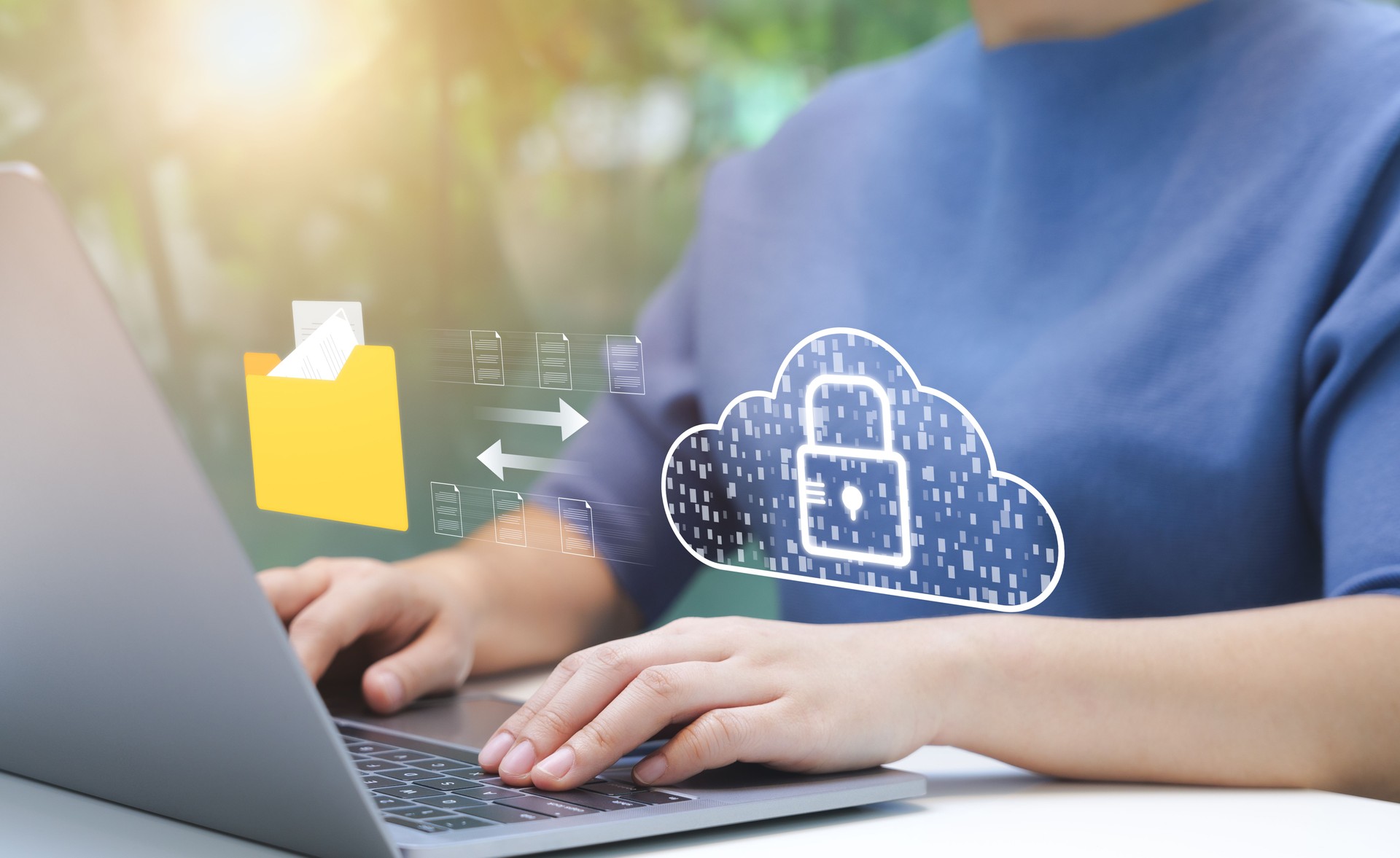 Person Managing Secure Cloud Data Transfer. An individual uses laptop to manage secure data transfer to cloud, virtual lock, representing robust cybersecurity measures. File storage, Manage folders,